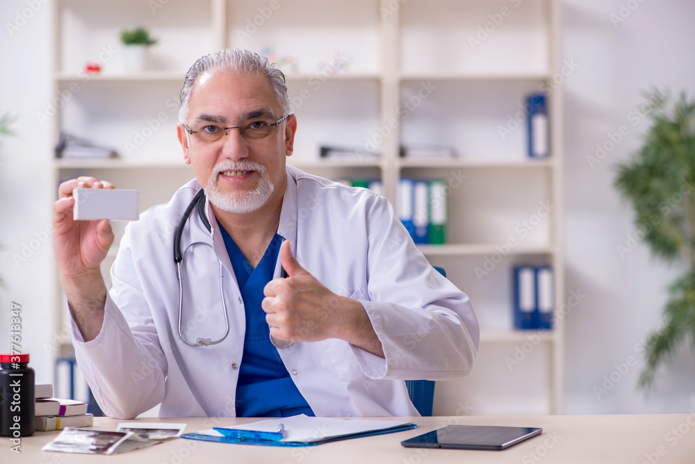 Male experienced doctor working in the clinic Male experienced doctor working in the clinic