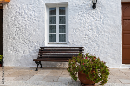 white wash wall and bench.