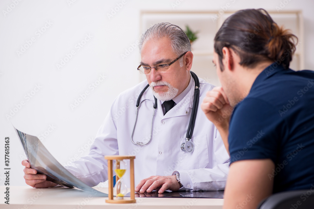 Male patient visiting doctor radiologist in time management conc