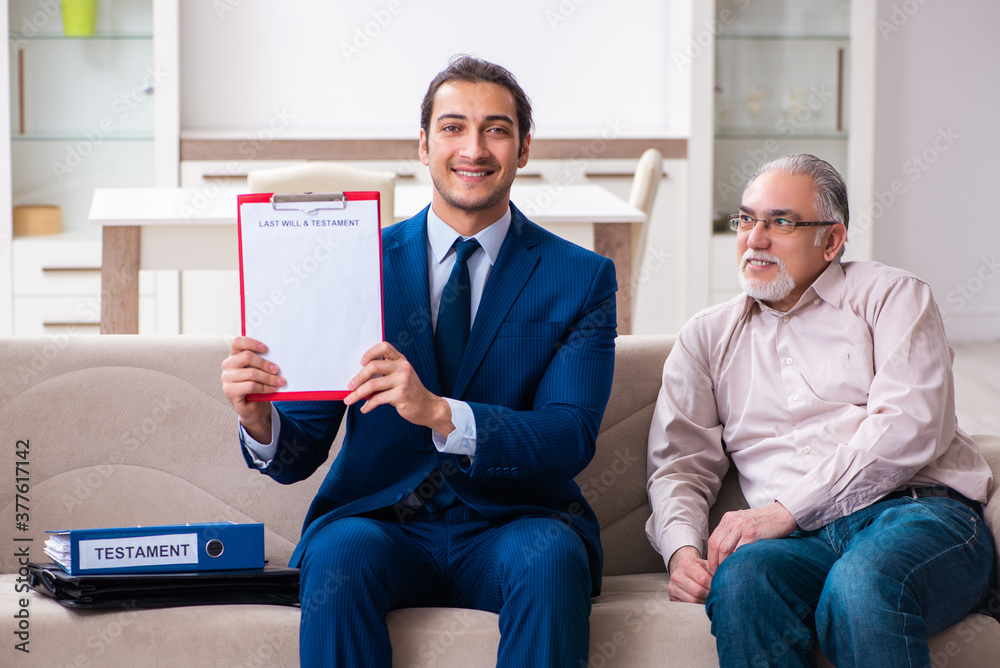 Young male lawyer visiting old man in testament concept Young male lawyer visiting old man in testament concept