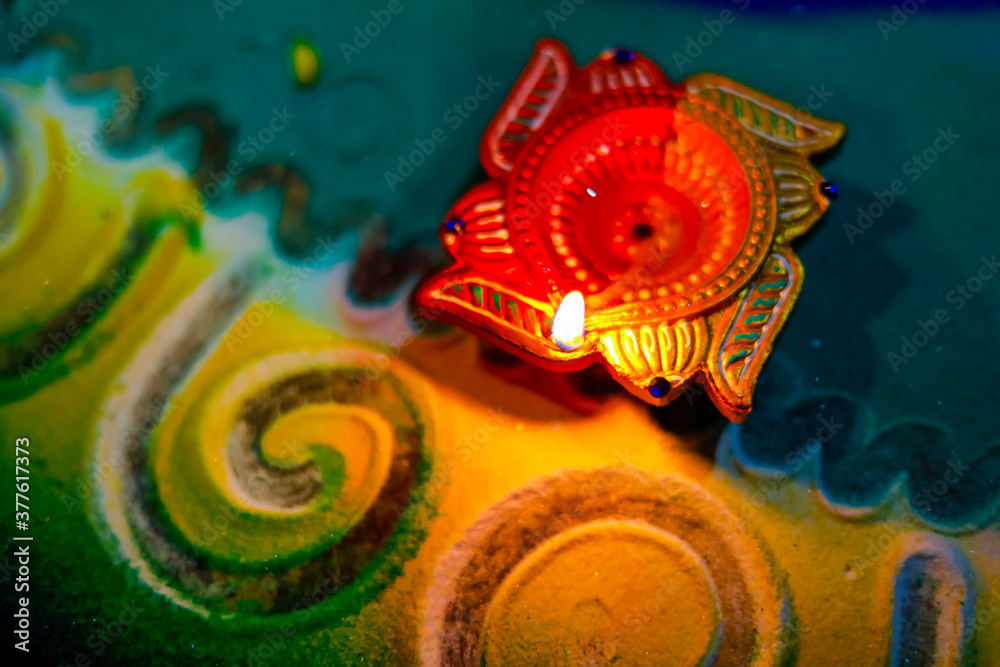 Fototapeta premium Indian Festival Diwali , lamp on colorful rangoli design