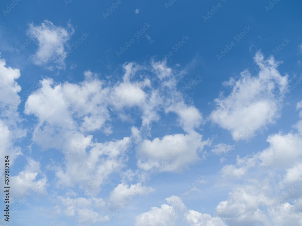 Whimsical clouds in the blue sky. Summer day Whimsical clouds in the blue sky. Summer day