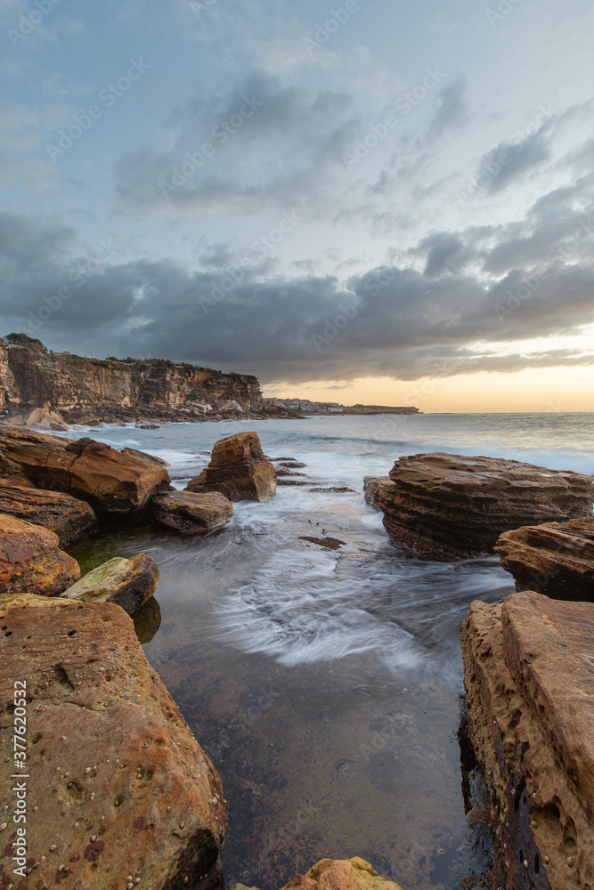 Rocky coastline view at Coogee Cliff, Sydney, Australia.
