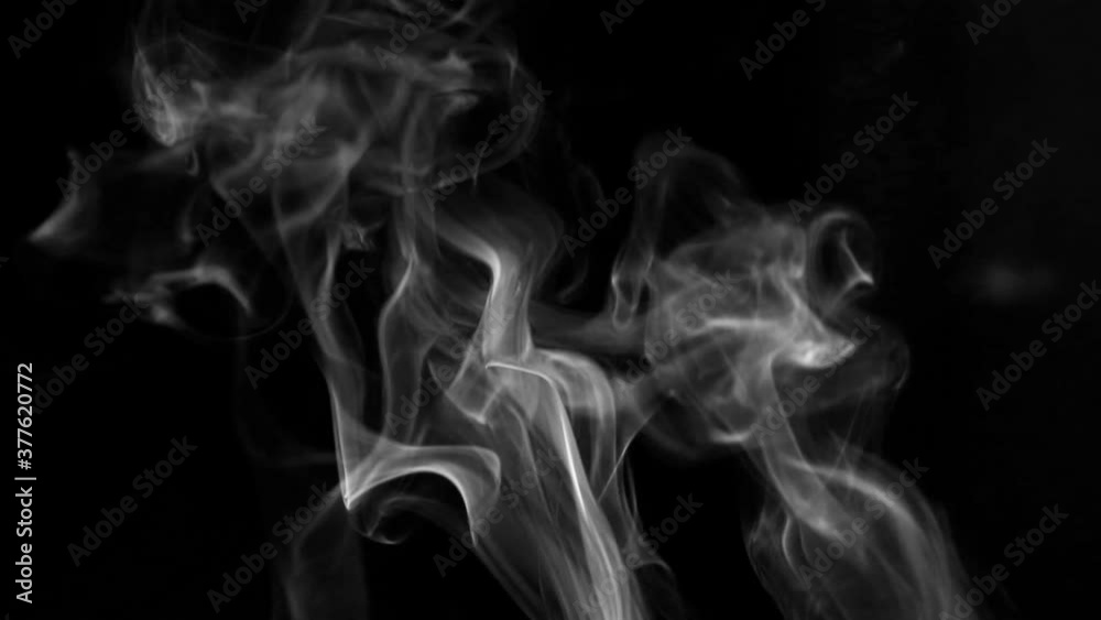 Texture of white smoke on a black background. Slow motion. Vape smoke. cigarette smoke clud. Texture of white smoke on a black background. Slow motion. Vape smoke. cigarette smoke clud.