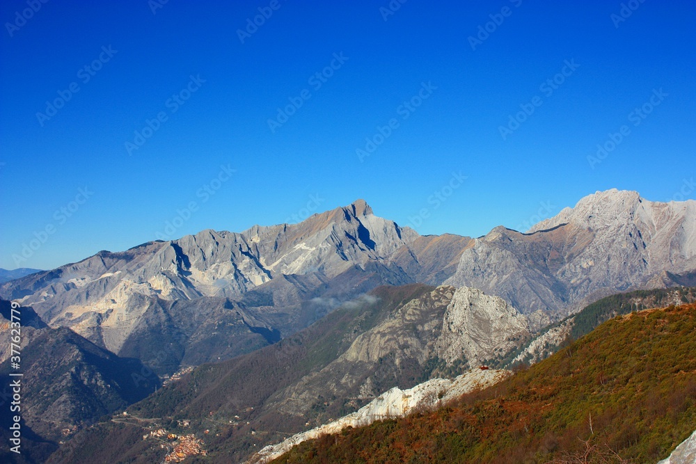 colorful sunset over the mountain peaks on the Apuan Alps of Tuscany in Italy