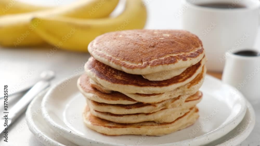 Serving stack of pancakes on a plate. Tasty fluffy pancakes served. Breakfast food Serving stack of pancakes on a plate. Tasty fluffy pancakes served. Breakfast food