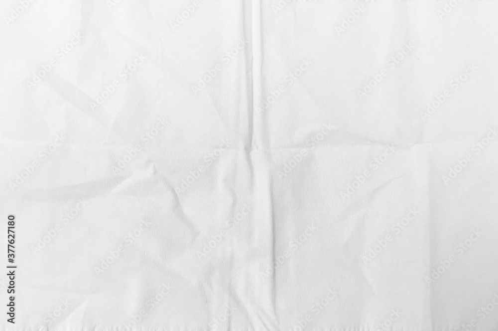The background is white crumpled paper. Texture of paper with kinks and dents, old and dilapidated. wrinkle recycle paper texture background. The background is white crumpled paper. Texture of paper with kinks and dents, old and dilapidated. wrinkle recycle paper texture background.