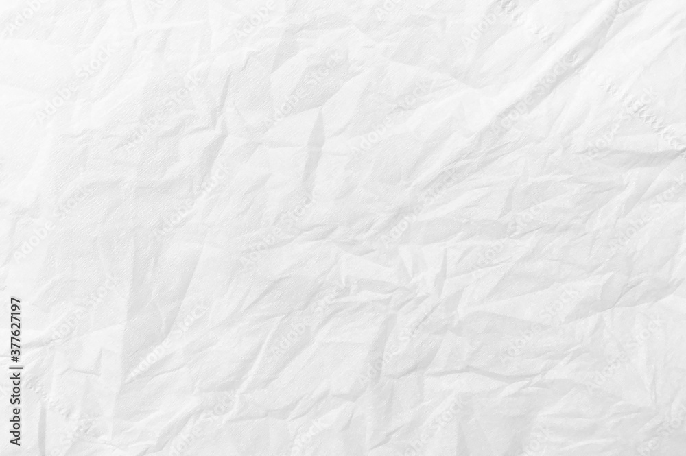 The background is white crumpled paper. Texture of paper with kinks and dents, old and dilapidated. wrinkle recycle paper texture background.