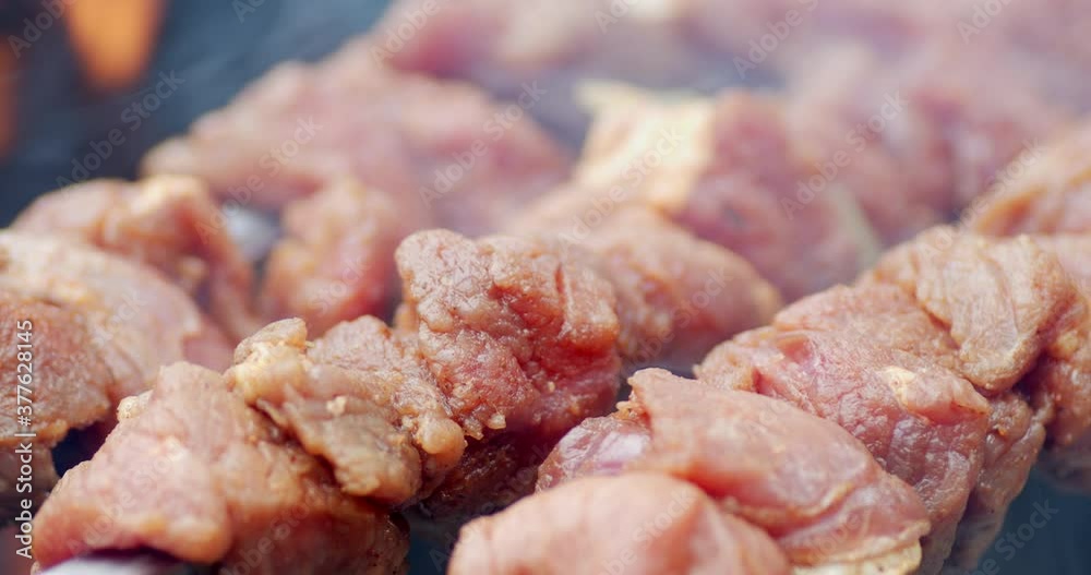 Delicious kebab over the flame of fire with smoke. 