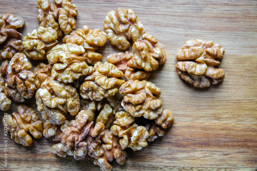 Walnut kernels on a cutting board Walnut kernels on a cutting board