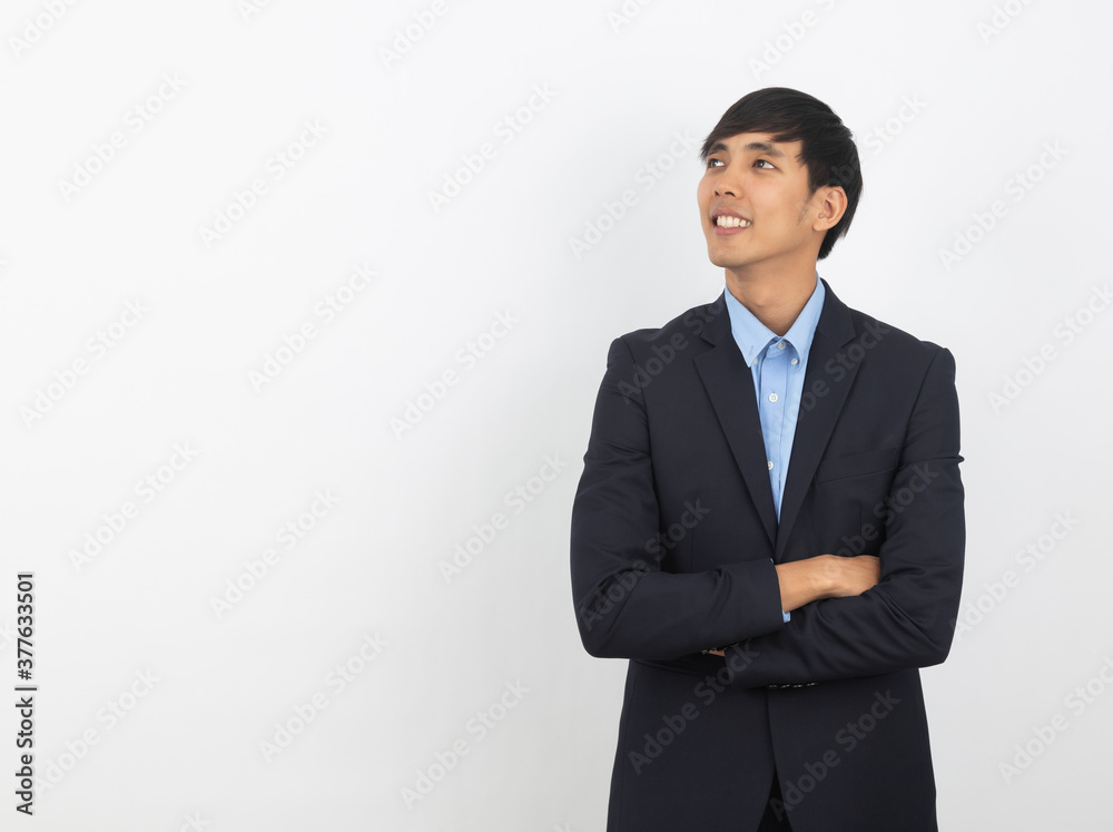 Young handsome asian business man thinking an idea while looking up isolated on white background. Young handsome asian business man thinking an idea while looking up isolated on white background.