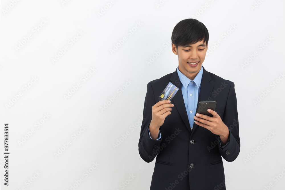 Young handsome asian business man using smartphone for online payment with smiling isolated on white background.