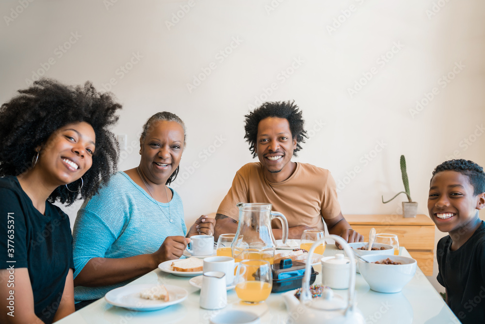 Family having breakfast together at home.