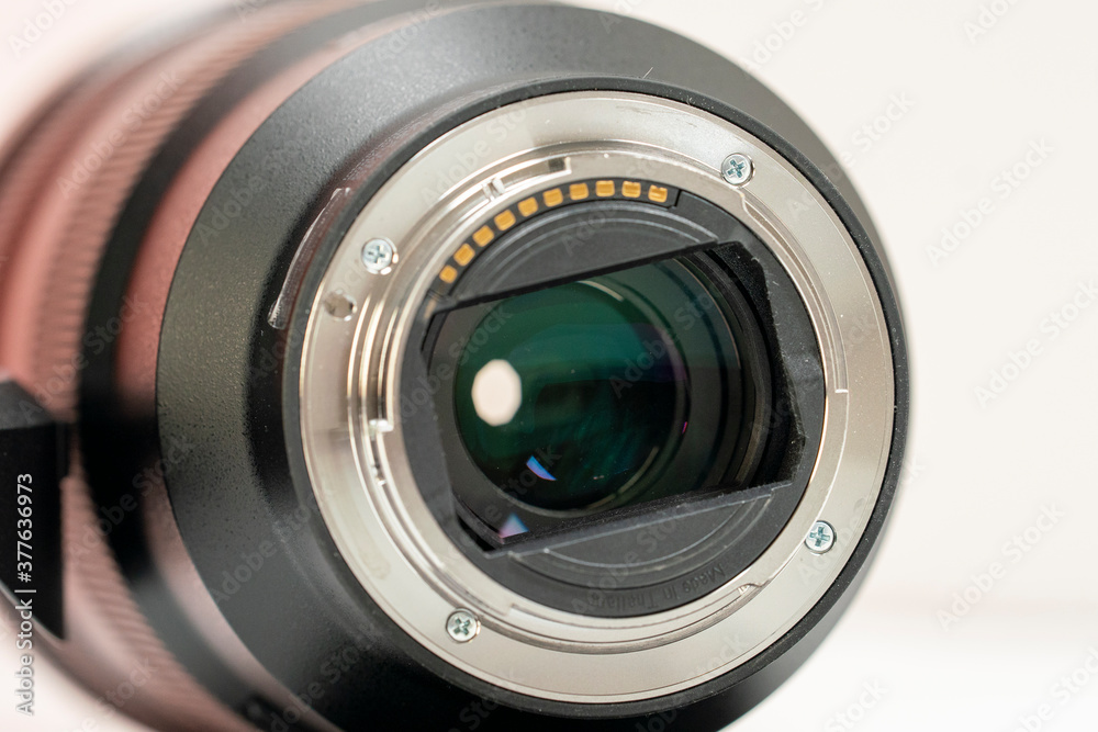 close up of a camera lens rear connection with reflection