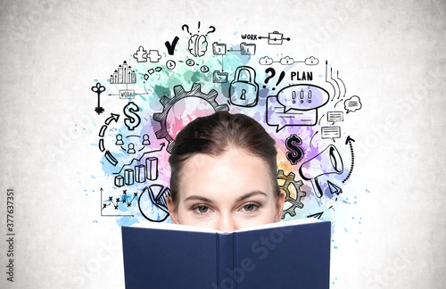 Woman with book and business strategy