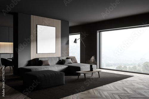 Gray living room corner with grey sofa and poster © ImageFlow