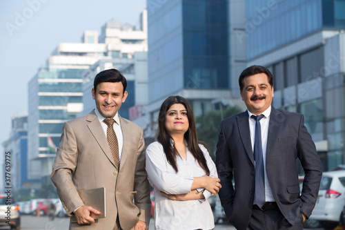 Photography Happy Indian Business man and woman looking at a camera