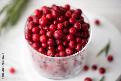 ripe lingonberries in a glass bowl