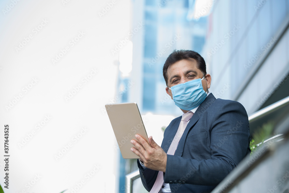 Businessman with protective face mask in city Businessman with protective face mask in city