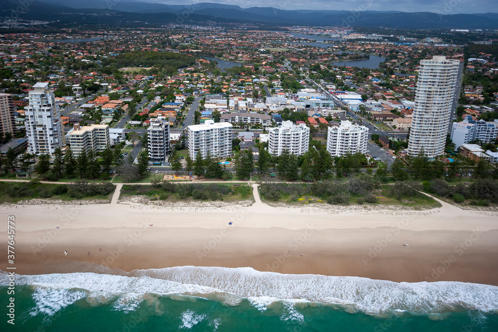 Fototapeta premium Empty beach in front of a city