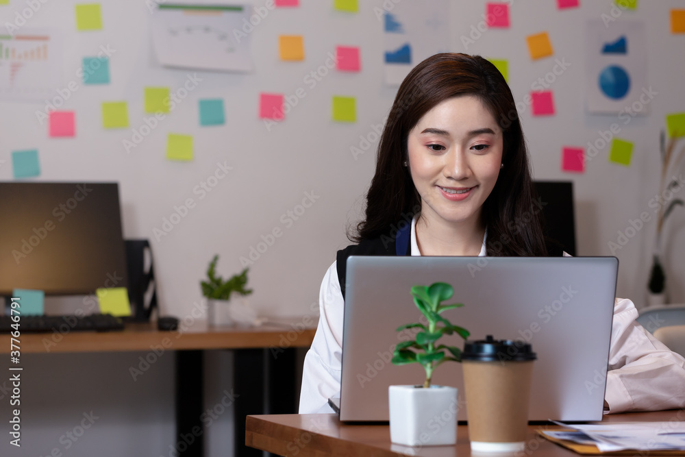 Business asian woman happy working job on laptop in office. Business asian woman happy working job on laptop in office.