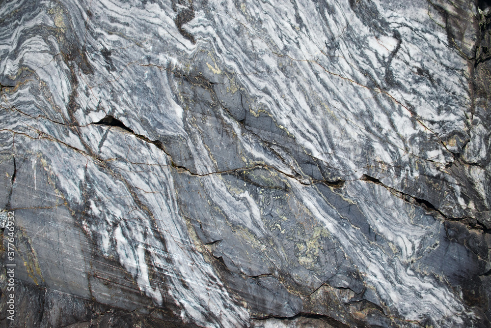 Real faceted marble stone. Background, texture.