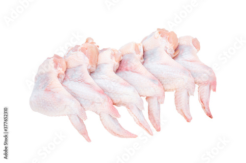 Six fresh chicken wings isolated on a white background.