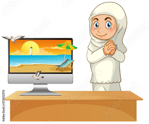 Muslim girl next to computer with beach on screen
