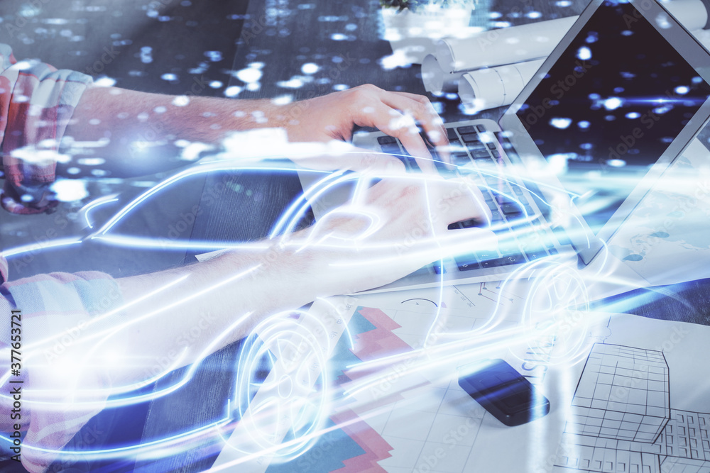 Automobile theme drawing with businessman working on computer on background. Autopilot taxi concept. Double exposure. Automobile theme drawing with businessman working on computer on background. Autopilot taxi concept. Double exposure.