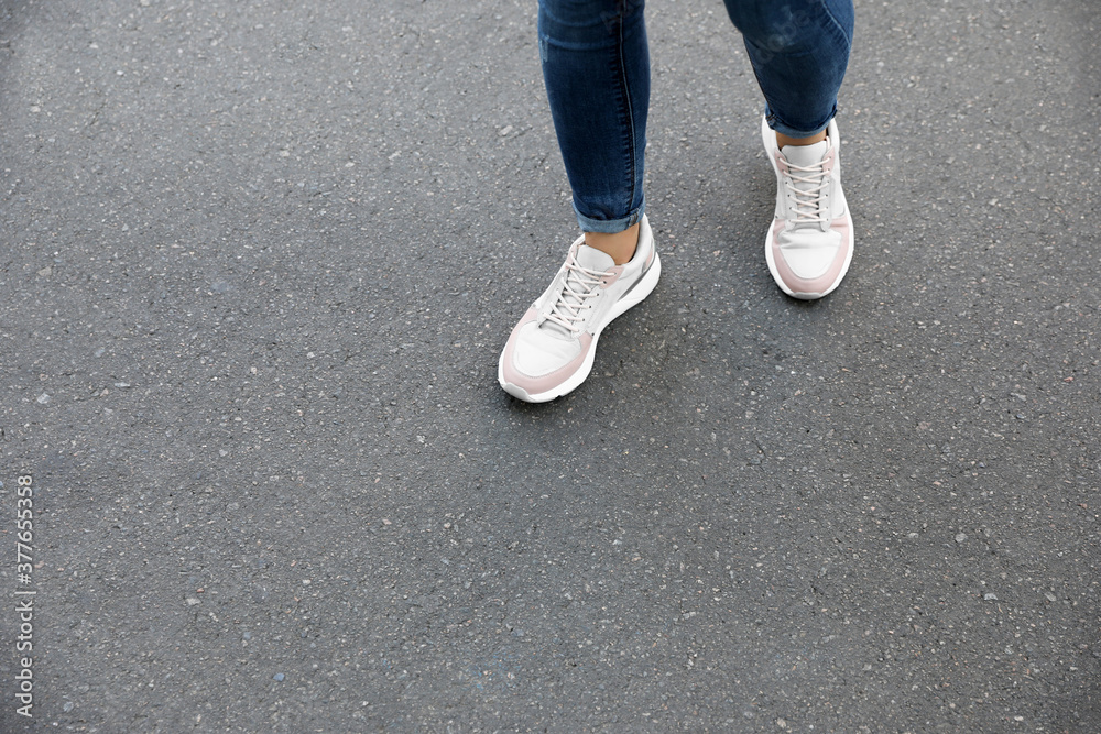 Woman walking outdoors, closeup with space for text. Choosing way concept.