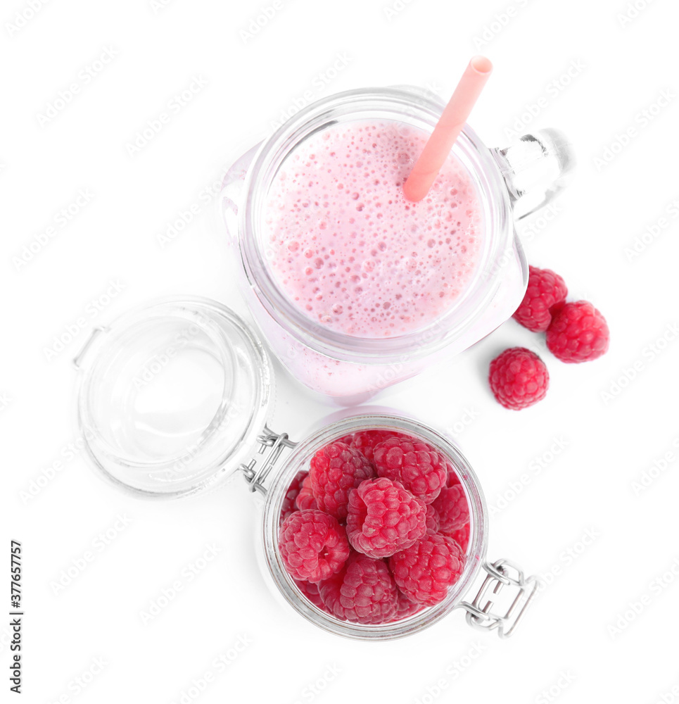 Tasty raspberry milk shake in mason jar and fresh berries isolated on white, top view Tasty raspberry milk shake in mason jar and fresh berries isolated on white, top view