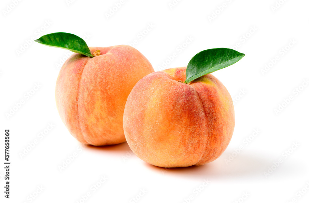 Two fresh sweet peach with green leaf isolated on white Two fresh sweet peach with green leaf isolated on white