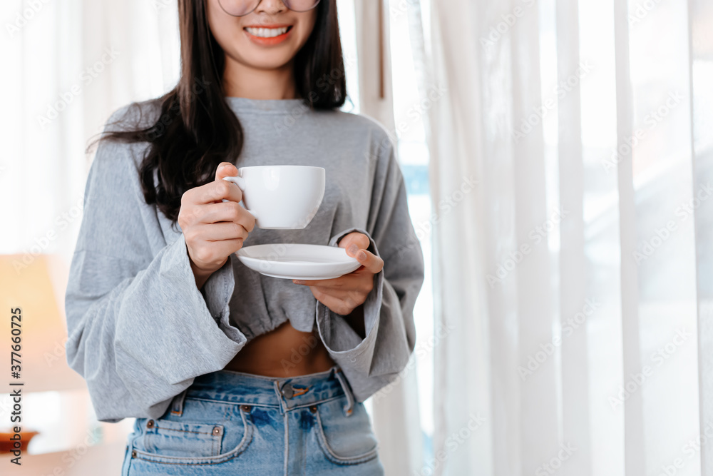 woman relxing time while working and hold cup of coffee at working place. woman relxing time while working and hold cup of coffee at working place.