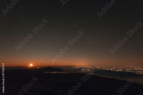 Moonrise with fog and clouds from the mountain in autumn