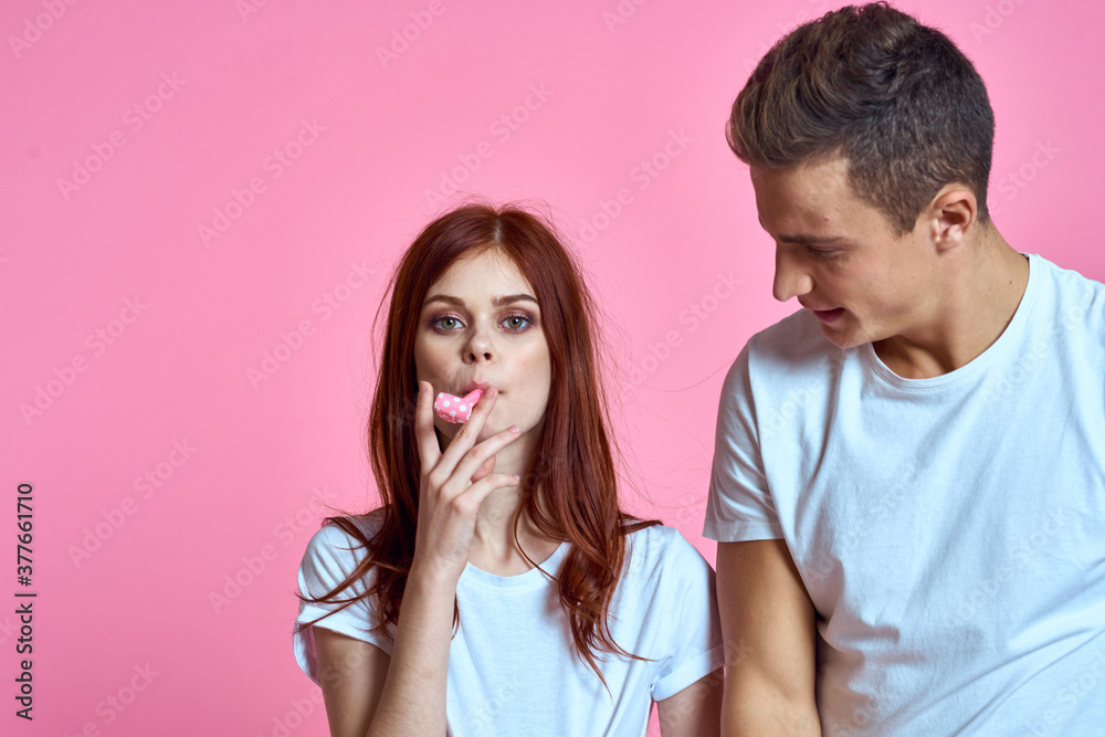 pregnant mom and happy father on pink background Young family waiting for baby pregnant mom and happy father on pink background Young family waiting for baby