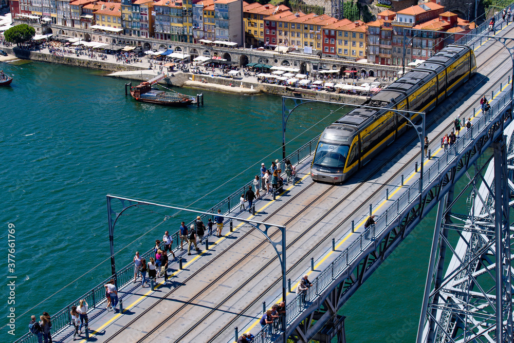 Train running on Dom Luis I Bridge, a double-deck bridge across the River Douro in Porto, Portugal