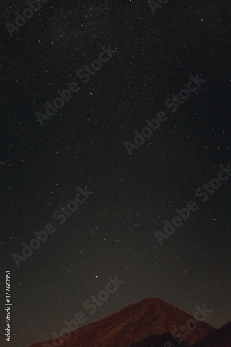 Mountain peak landscape in the night with stars above