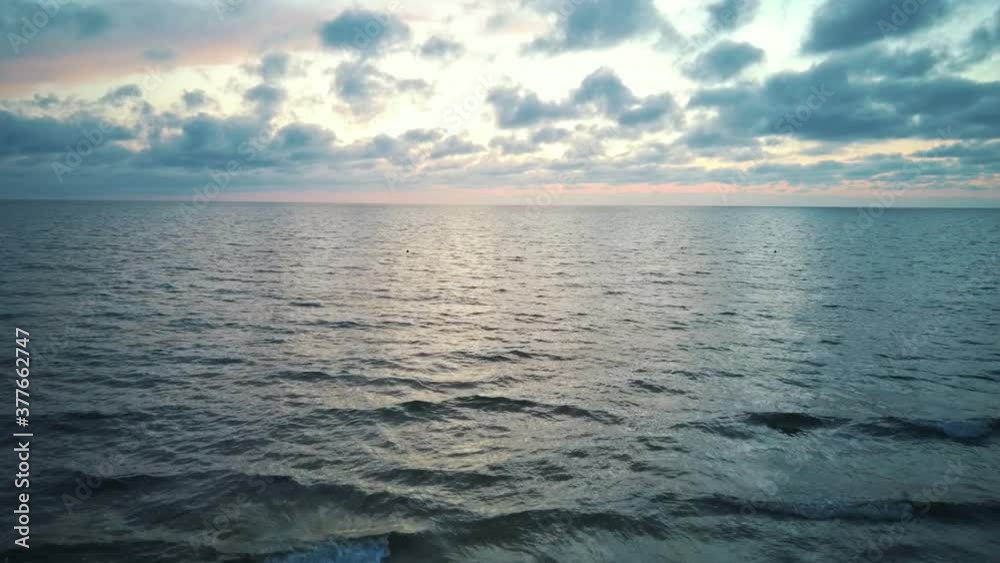 Dron Flying Over Sea in a Beautiful Sunset. Sunrise Over the Sea. Colorful Sunset on the Baltic Sea, Latvia, Saulkrasti. Dron Flying Over Sea in a Beautiful Sunset. Sunrise Over the Sea. Colorful Sunset on the Baltic Sea, Latvia, Saulkrasti.