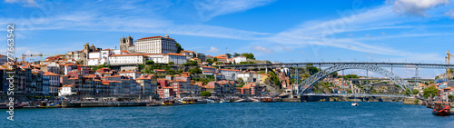 Panorama of the riverbank of Ribeira District and Dom Luis I Bridge in Porto, Portugal