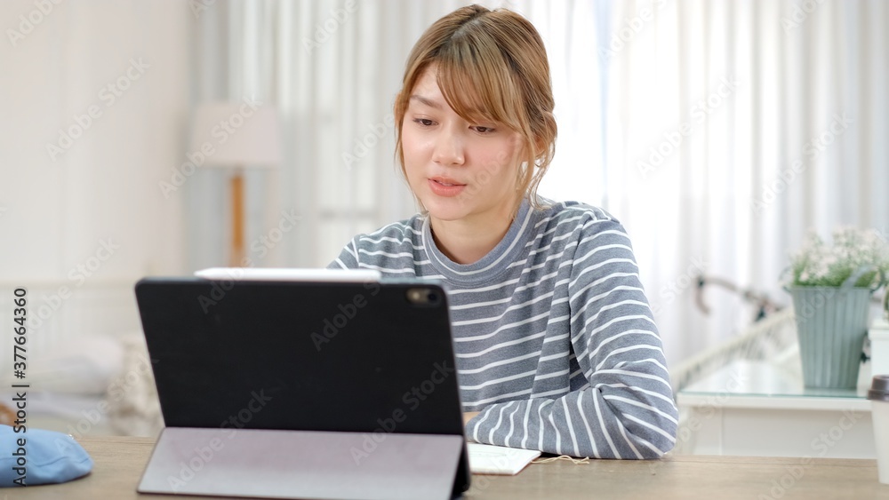 Online Group Video Call Conference of Work Team from Home Office.Smiling young asian woman blogger vlogger influencer sit at home speaking.online with internet teacher learn language talk .woman make Online Group Video Call Conference of Work Team from Home Office.Smiling young asian woman blogger vlogger influencer sit at home speaking.online with internet teacher learn language talk .woman make