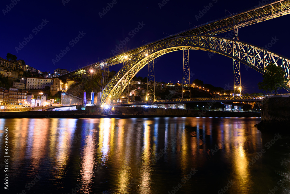 Night view of Dom Luis I Bridge, a double-deck bridge across the River Douro in Porto, Portugal