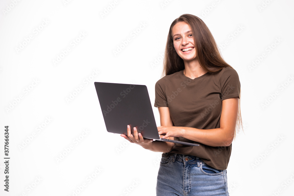 Portrait of a happy woman using laptop computer isolated on a white background Portrait of a happy woman using laptop computer isolated on a white background