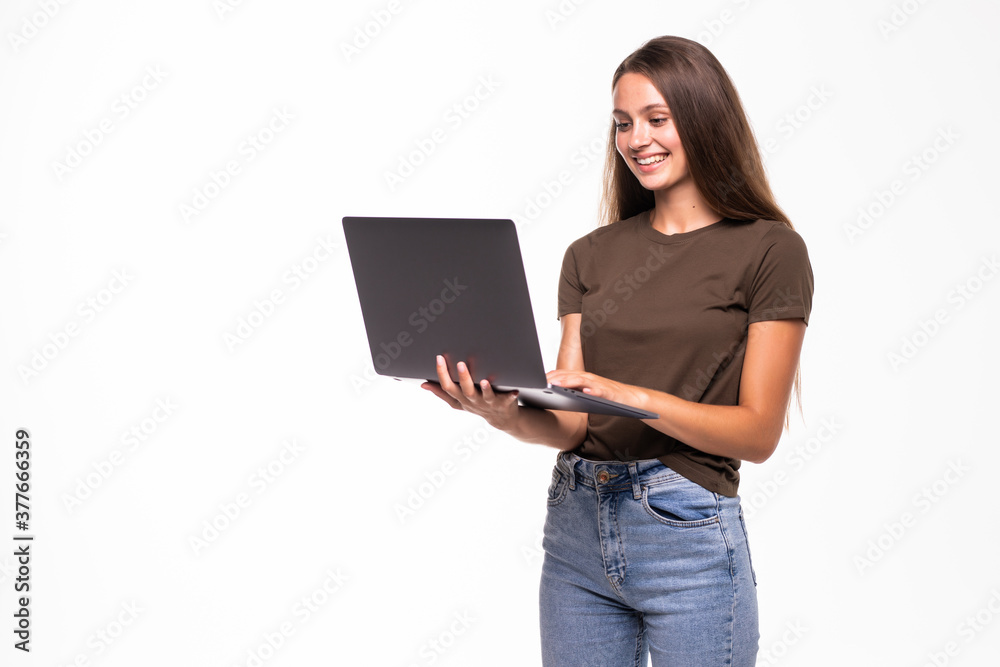 Portrait of a happy woman using laptop computer isolated on a white background Portrait of a happy woman using laptop computer isolated on a white background