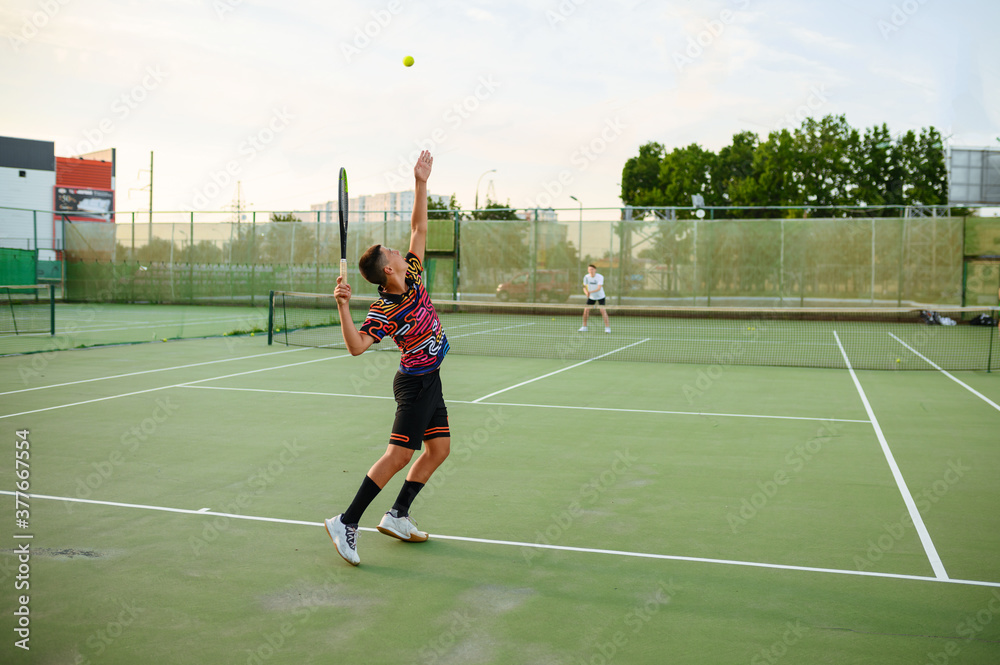 Male tennis players, training on outdoor court
