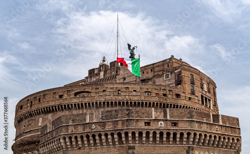 Rome Italy, Saint Angel castle with Italian flag under impressive sky