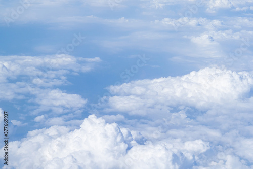 Aerial view of cloudscape seen through airplane window © meeboonstudio