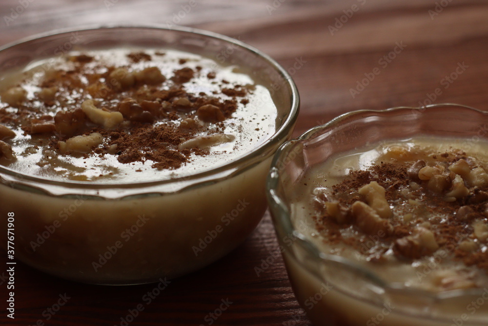 Traditional Turkish dessert Asure with walnuts. (Noah's Pudding). Close up. Traditional Turkish dessert Asure with walnuts. (Noah's Pudding). Close up.