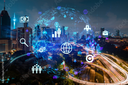 Canvas Print Glowing Social media icons on night panoramic city view of Kuala Lumpur, Malaysia, Asia