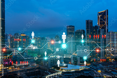 Photography Glowing Social media icons on night panoramic city view of Kuala Lumpur, Malaysia, Asia
