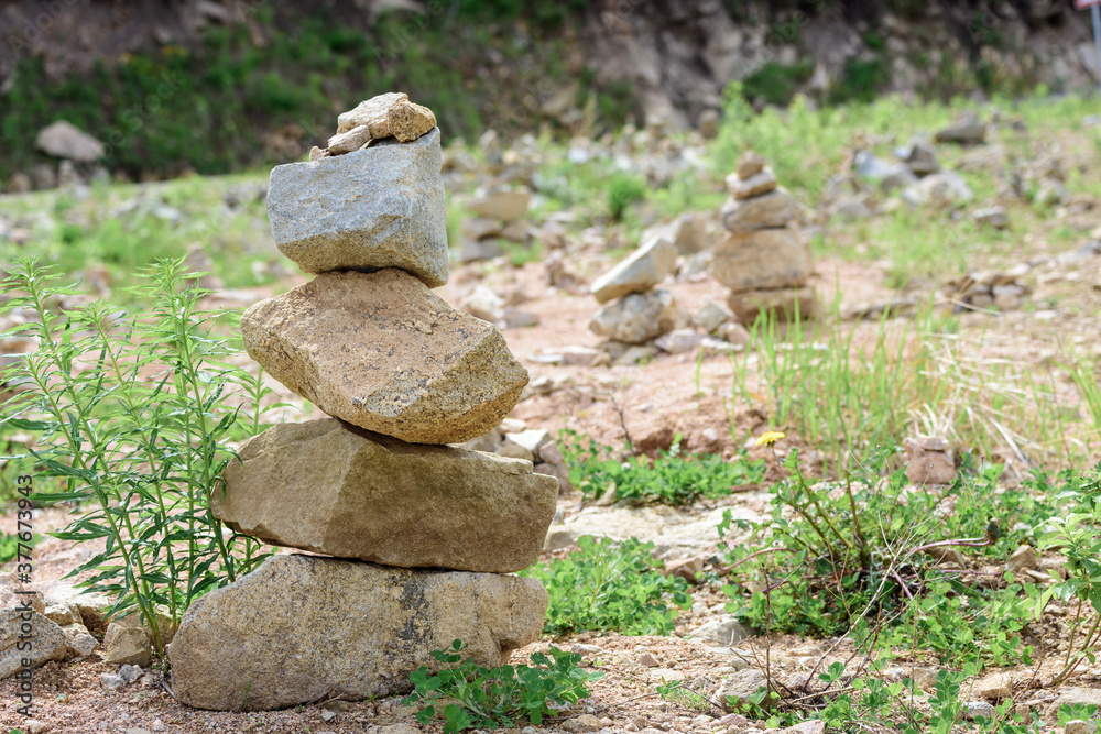 Folded pyramid of different stones in the mountains. Folded pyramid of different stones in the mountains.